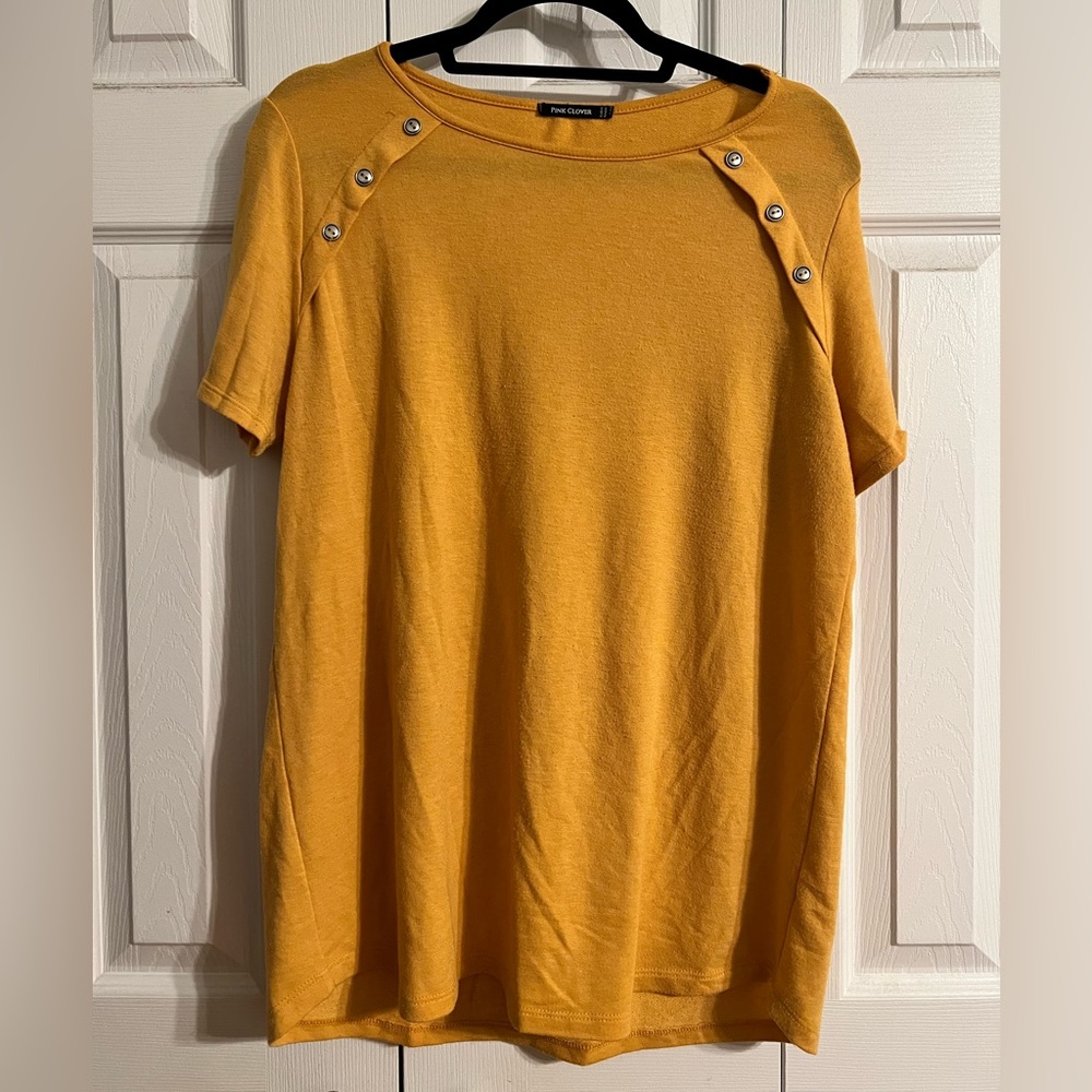 Large, gold blouse